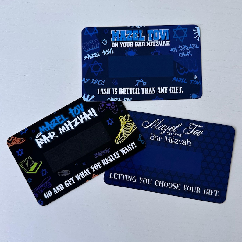 May include: Three blue and black cards with a black scratch-off area. The cards have a blue and black background with a variety of graphics including stars, a game controller, a skateboard, and a sneaker. The text on the cards reads "Mazel Tov on your Bar Mitzvah", "Cash is better than any gift", and "Go and get what you really want!" and "Letting you choose your gift."