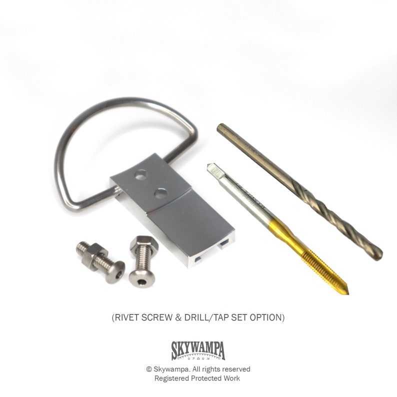 May include: A silver metal handle with two silver screws and a drill bit and tap set. The text (RIVET SCREW & DRILL/TAP SET OPTION) is printed below the handle. The text SKYWAMPA is printed below the text. The text Skywampa. All rights reserved Registered Protected Work is printed below the logo.