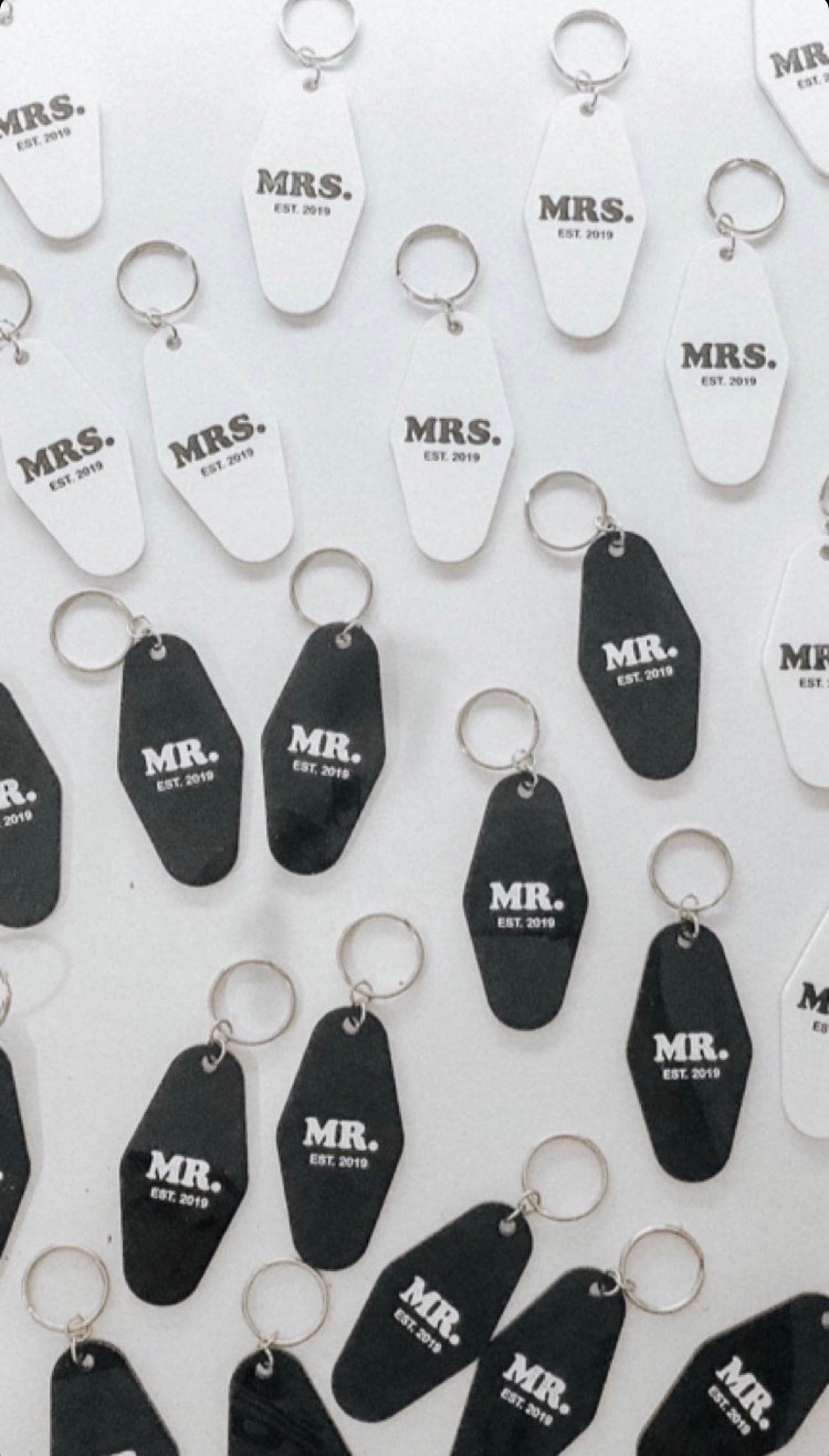 black or white custom motel keychain with gold lettering