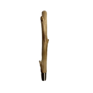 May include: A wooden beer tap handle with a natural brown finish and a small branch detail. The handle has a metal base.