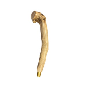 May include: A wooden beer tap handle with a natural finish and a gold metal base.