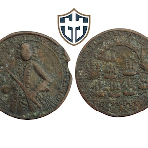 May include: Two antique bronze coins. One coin features a figure holding a weapon, with surrounding text. The other coin shows a nautical scene with ships. Both coins have a weathered appearance and are set against a white background.