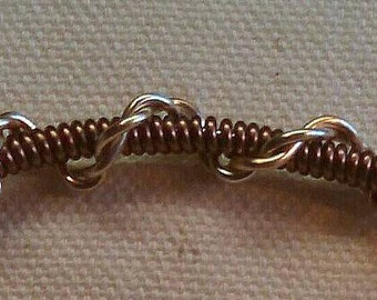 Tricolour twisted and coiled wire bracelet.