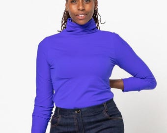 May include: A long-sleeved, turtleneck shirt in a vibrant purple color. The shirt is made of a soft, stretchy fabric and has a close fit.