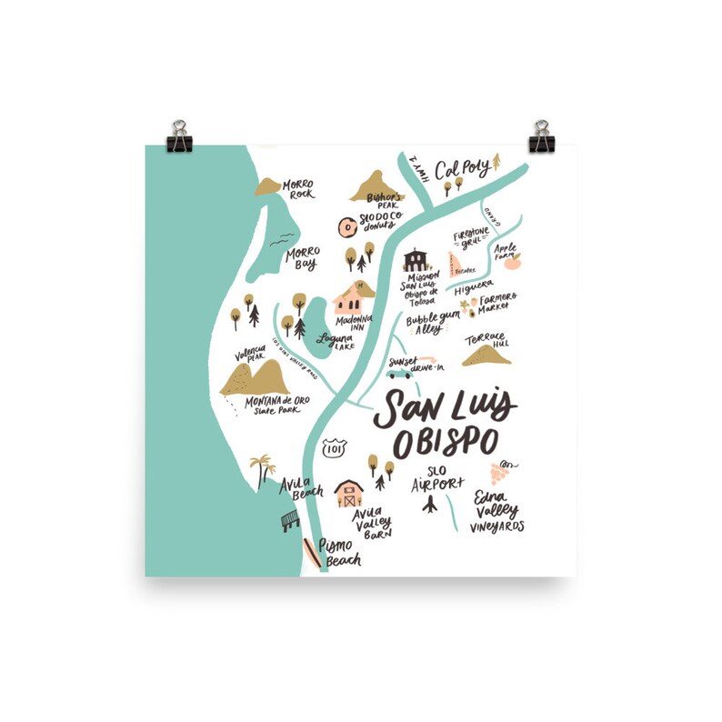 May include: A hand-drawn map of San Luis Obispo, California, with a turquoise and white color scheme. The map features landmarks, businesses, and points of interest, including Morro Rock, Morro Bay, Avila Beach, Pismo Beach, Cal Poly, and the SLO Airport. The map is surrounded by a white border.