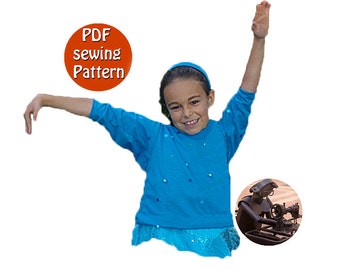 May include: A girl wearing a blue long-sleeved shirt with a sparkly turquoise skirt, raising her right arm in the air. The image includes a red circle with the text "PDF sewing Pattern".