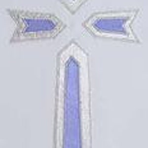 May include: A white cross with a blue centre. The cross is made of fabric and has a simple design.