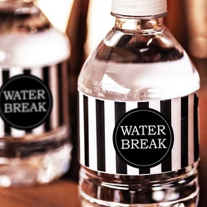 May include: Two clear plastic water bottles with black and white striped labels that say "Water Break" in a circle.