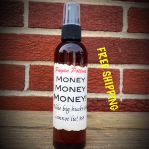 May include: A brown glass bottle with a black spray top and a white label that reads "Pagan Potions MONEY MONEY MONEY! I like big bucks and cannot lie! $$$"