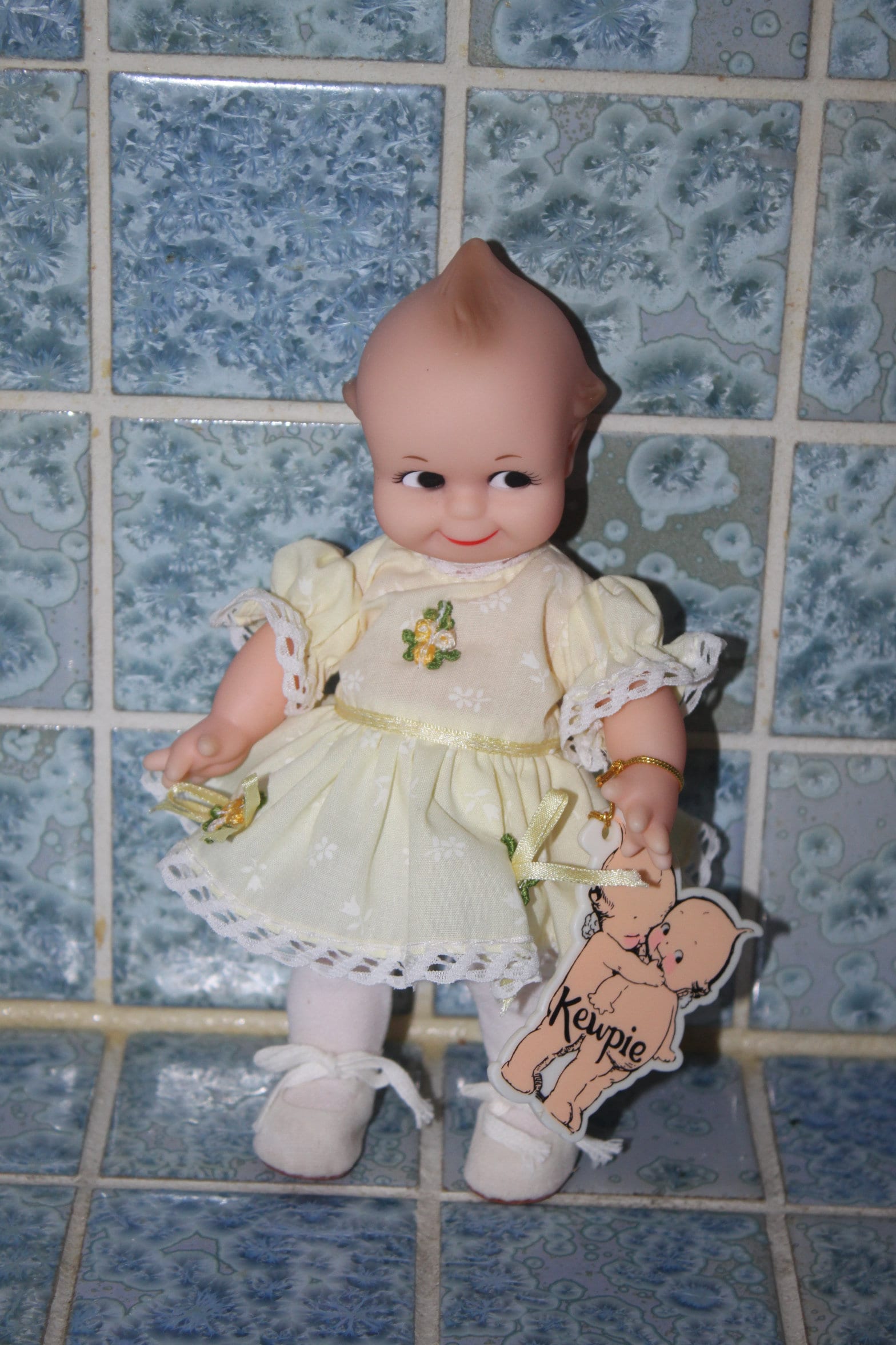 Vintage Kewpie Doll With yellow Floral Dress By Jesco