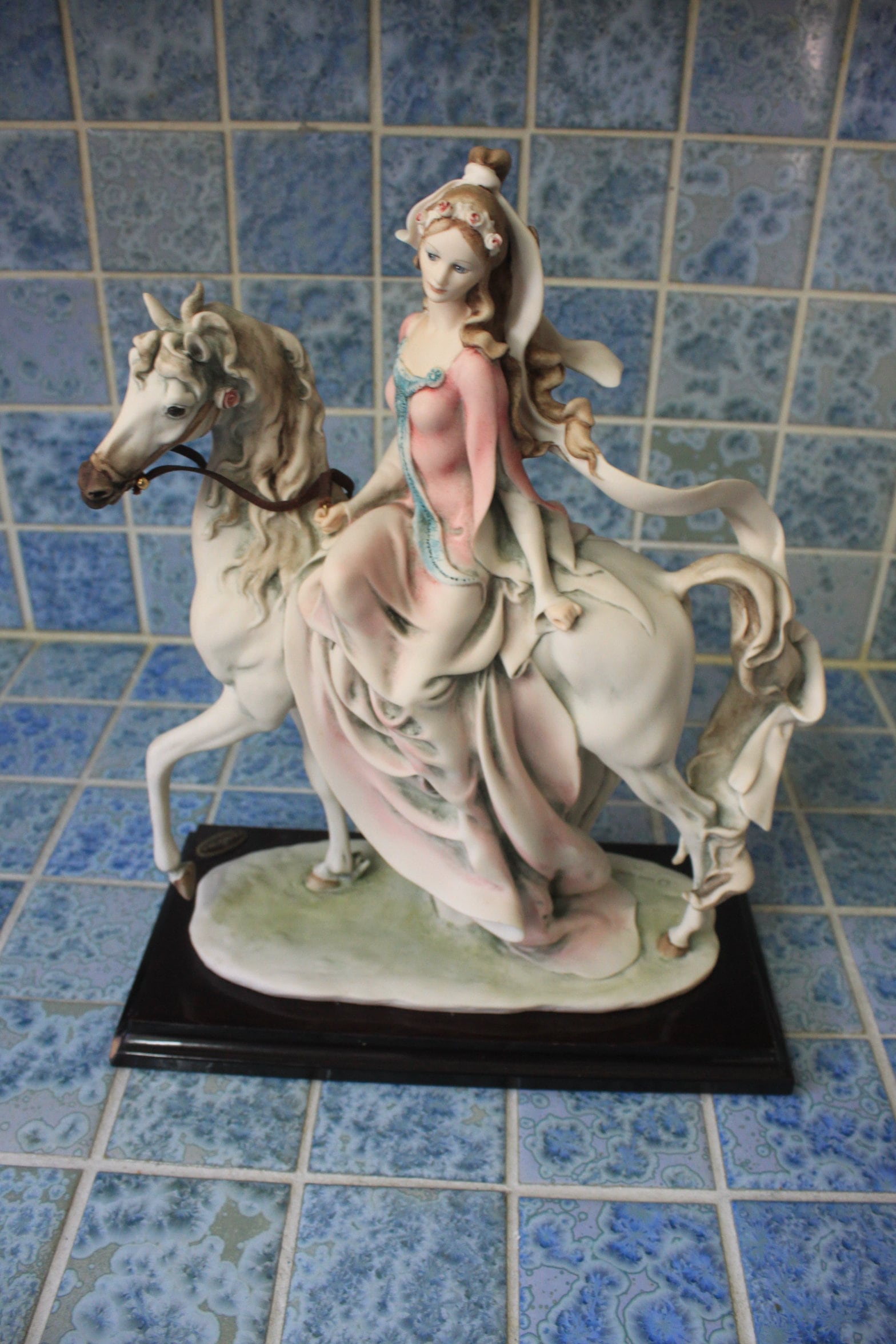 Capodimonte figurine of lady riding horse *By artist G. Armani, signed