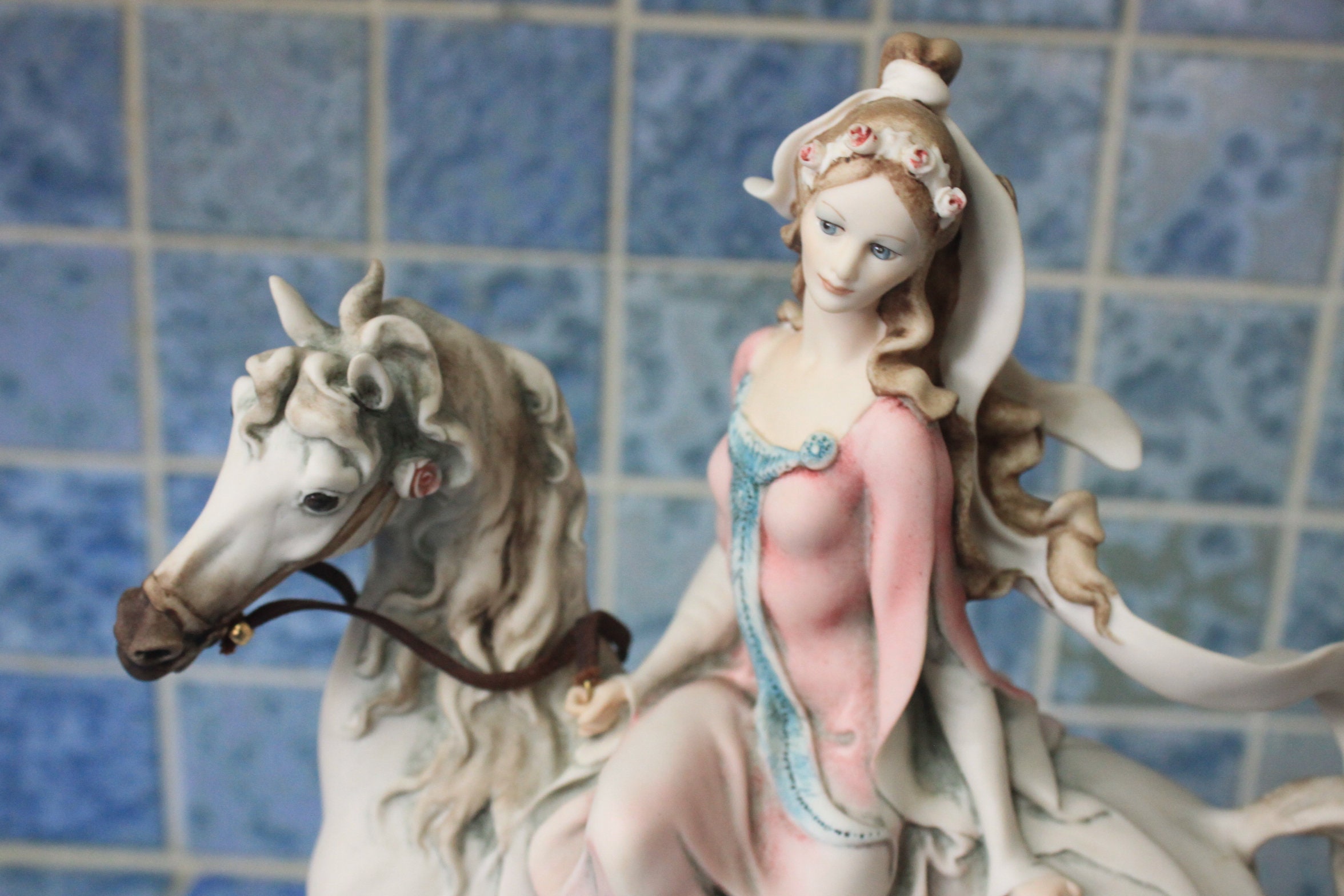 Capodimonte figurine of lady riding horse *By artist G. Armani, signed