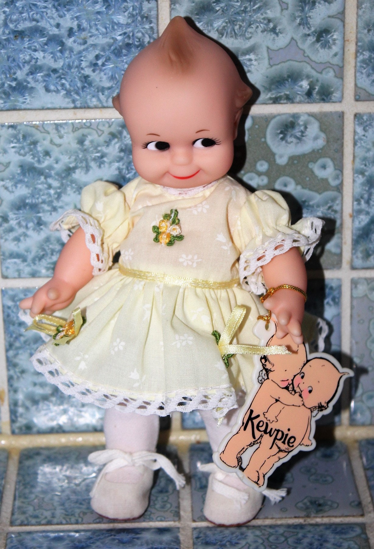 Vintage Kewpie Doll With yellow Floral Dress By Jesco