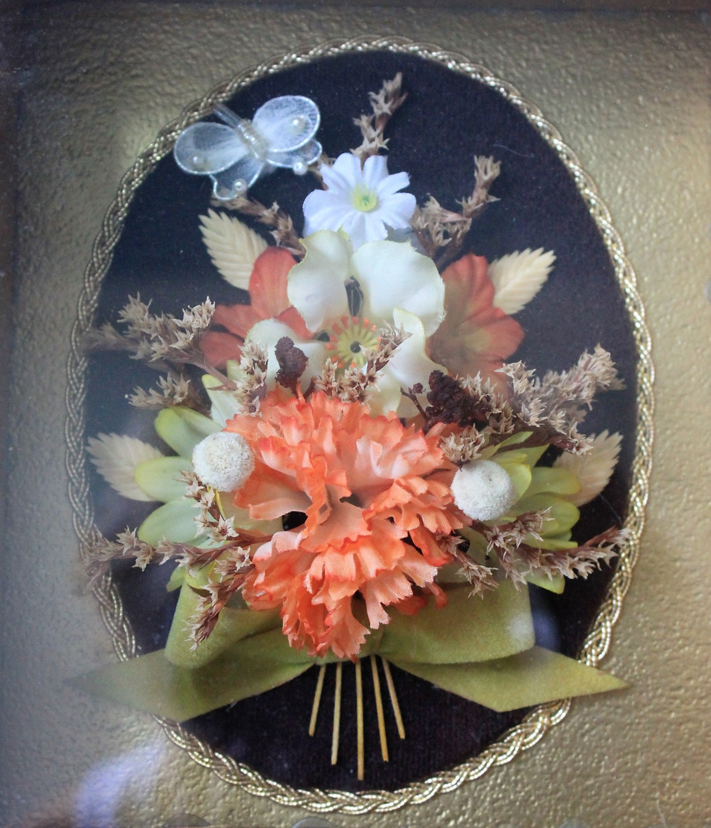 Beautiful small dried floral arrangement inside a very deep ornate gold frame