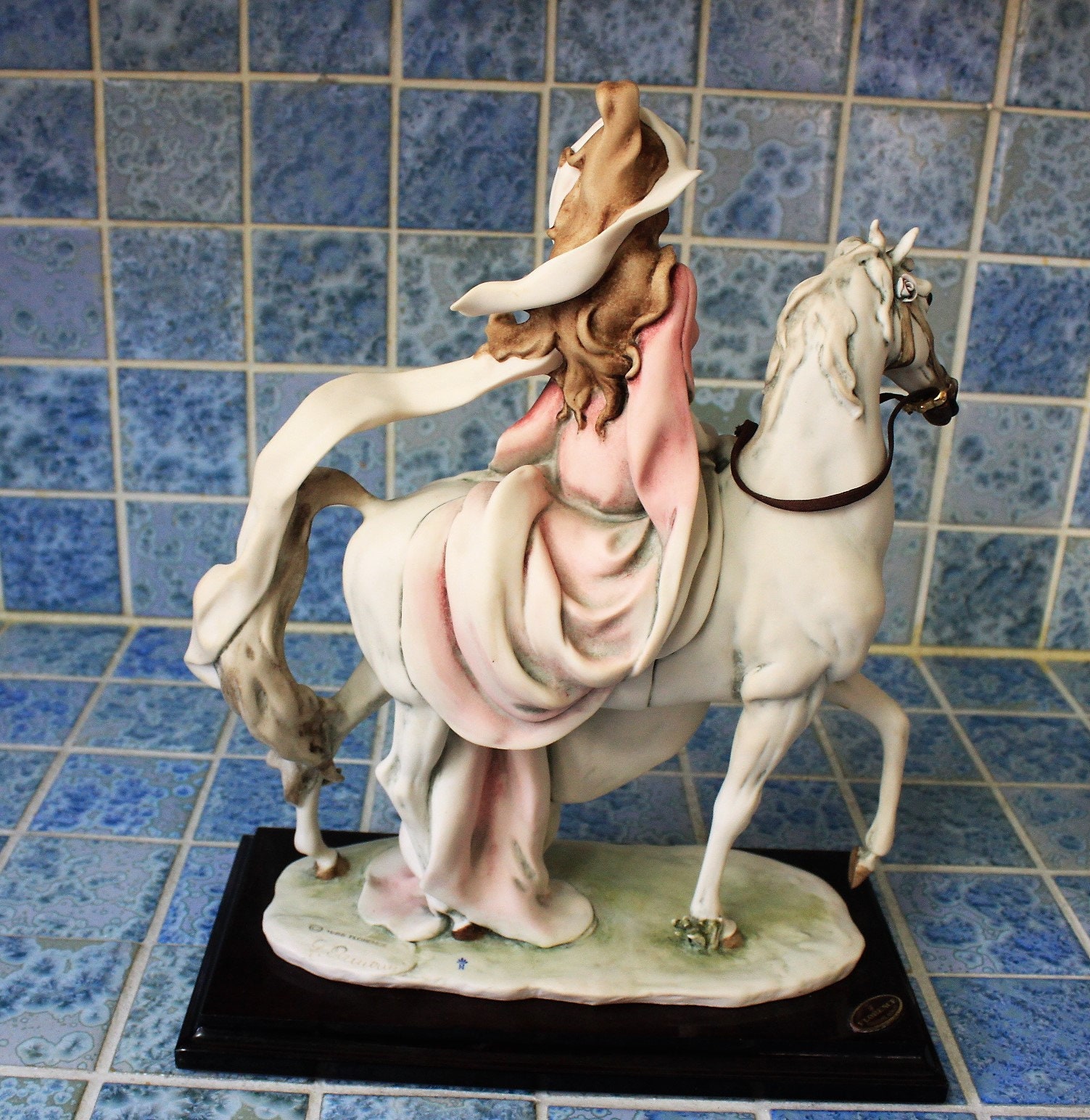 Capodimonte figurine of lady riding horse *By artist G. Armani, signed