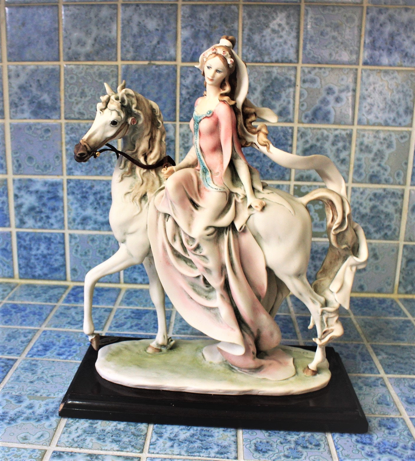 Capodimonte figurine of lady riding horse *By artist G. Armani, signed