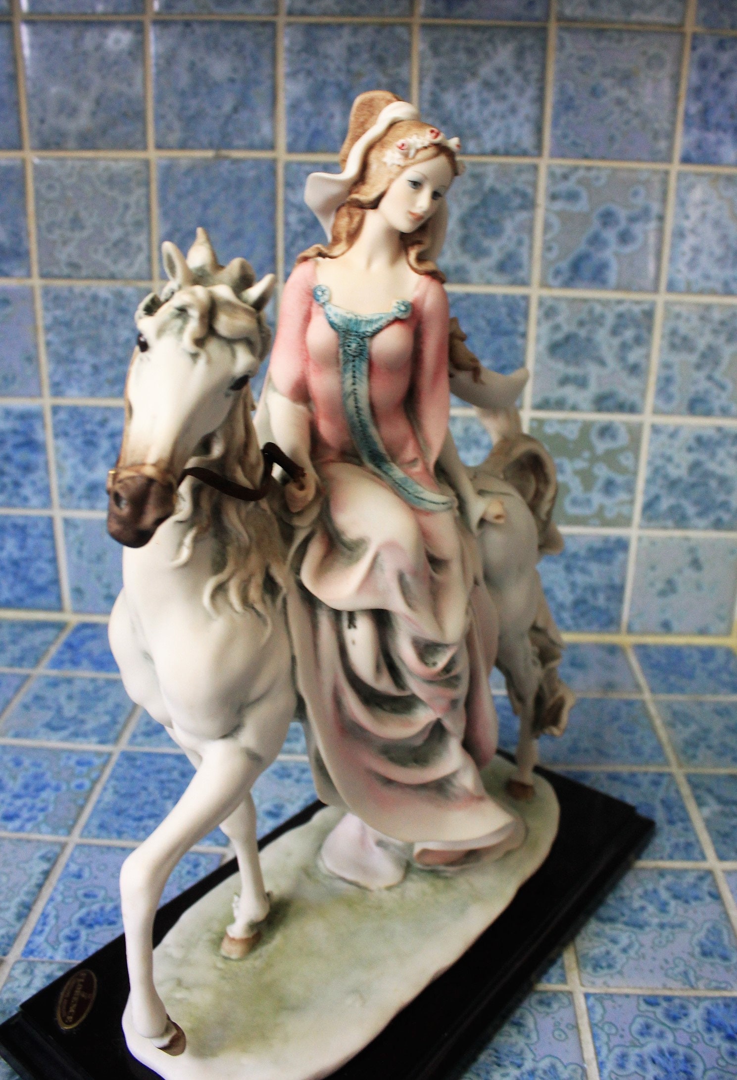 Capodimonte figurine of lady riding horse *By artist G. Armani, signed