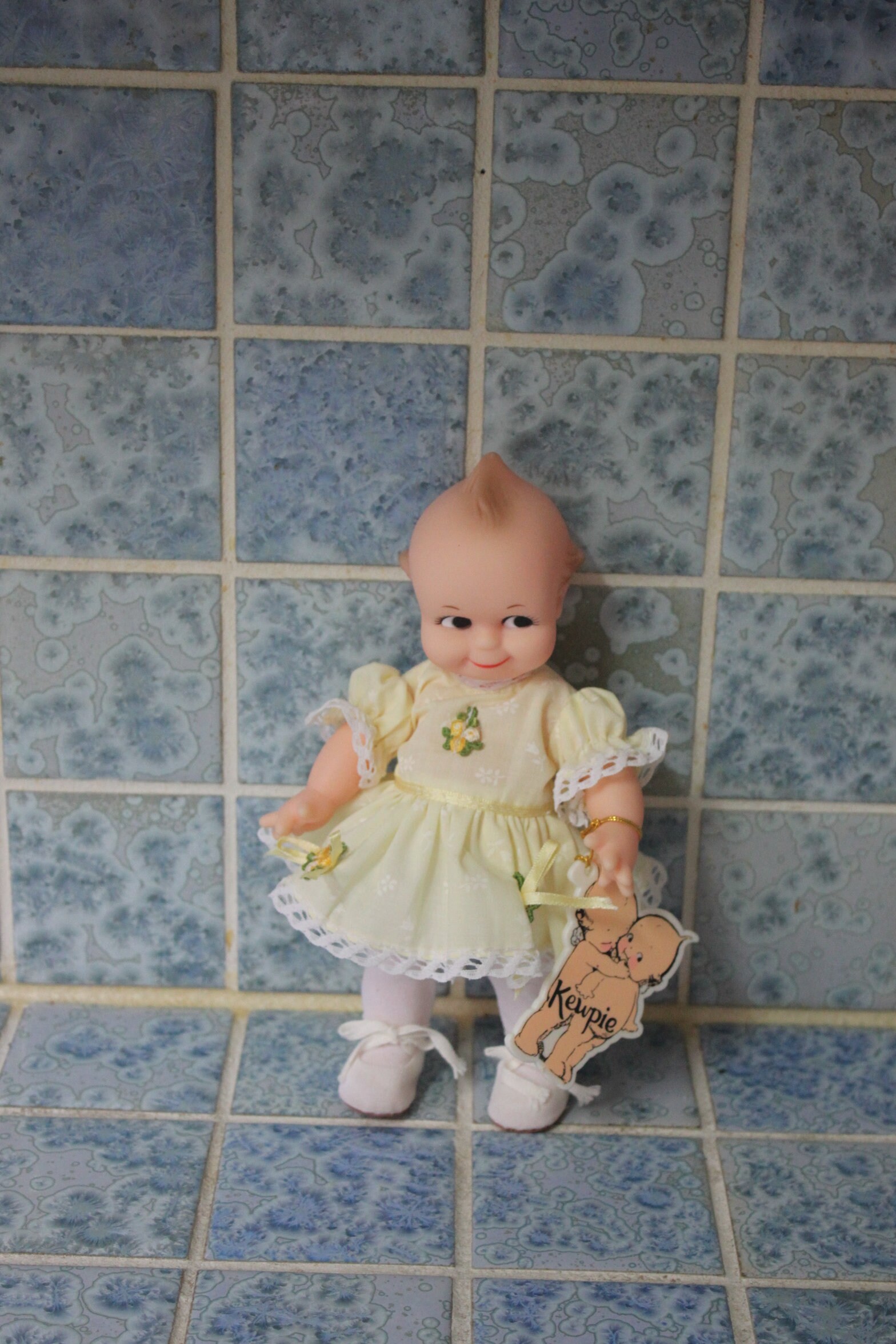 Vintage Kewpie Doll With yellow Floral Dress By Jesco