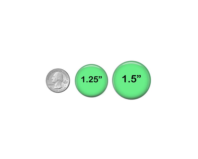 a penny and two green buttons with the same size