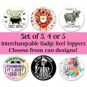 May include: Set of 5 interchangeable badge reel toppers with various designs. The designs include a lion with flowers, a hippopotamus with Christmas lights, a cauldron with a witch's hat, a skeleton with a drink, and a brain with flowers.