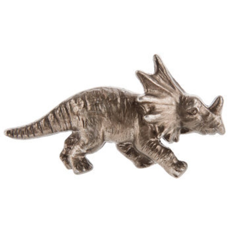 May include: A silver triceratops figurine. The dinosaur has three horns, a frill, and textured skin. The figurine is in a walking pose, showcasing its legs and tail.