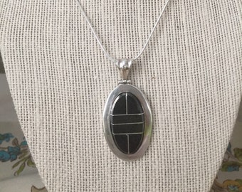 Black Goldstone Pendant Inlaid With Sterling Silver on a Sterling Silver Snake Chain.