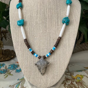 Southwestern Style Sterling Silver Buffalo Pendant on a Necklace of Turquoise, Bone and Shell Heishi.