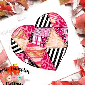 May include: A pink and gold patchwork heart design with black and white stripes. The heart is made up of different geometric shapes and patterns.