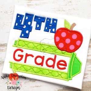 May include: A white t-shirt with a blue and white polka dot 4th grade design. The design includes a green crayon and a red apple with pink polka dots.