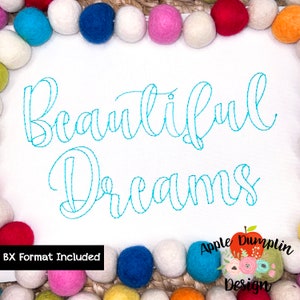 Könnte beinhalten: Stickerei auf weißem Stoff mit dem Text "Beautiful Dreams" in blauer Kursivschrift. Das Design ist von einem Rand aus bunten Pompons umgeben.