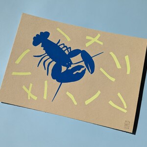 May include: A blue lobster illustration on a brown background with yellow lines. The text "01.15.21" is in the bottom right corner.