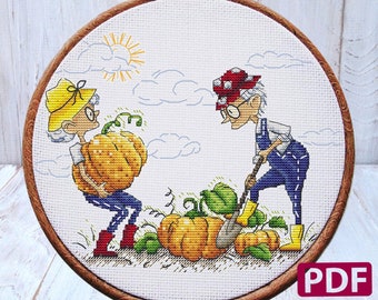 May include: Cross stitch pattern featuring two cartoon characters, a woman carrying a large orange pumpkin and a man digging in the ground with a shovel. There are several pumpkins in the scene, along with a sun and clouds. The pattern is framed in a wooden hoop. The text "PDF" is in the lower right corner of the image. The text "Sweet Annet" is at the bottom of the image.
