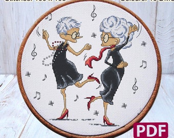 May include: Cross stitch pattern of two women dancing with musical notes and a hashtag symbol. The pattern is 7.14 inches by 7.50 inches and uses 16 DMC colors. The pattern is titled "Sweet Annet" and includes a PDF download.