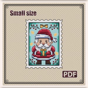 May include: A cross stitch pattern titled "Christmas Santa" featuring a small postage stamp design. The image shows a Santa Claus figure holding a gift, surrounded by stars and berries on a teal background. Includes PDF format and 2.5 x 3.3 inch size.