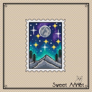 May include: A blue and purple night sky with a full moon and stars. The sky is over a snowy mountain range with trees. The image is in a vintage postage stamp frame.
