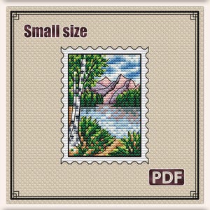 May include: Cross stitch pattern stamp featuring a landscape with a lake, mountains, and birch trees. The design is in a small size, measuring 2.5 x 3.3 inches. The PDF pattern includes 23 DMC colors and is labeled S-147.