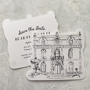 May include: Two white, uniquely shaped cards. One card features the text "Save the Date" and the date "05.28.27". The other card has a black and white line drawing of a building. The cards are for a formal invitation weekend.
