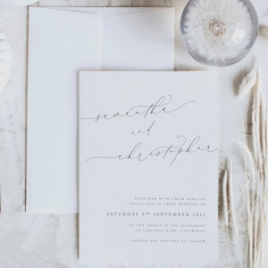 Unique wedding invitations. Elegant wedding invitations. Simple white and black wedding invites.