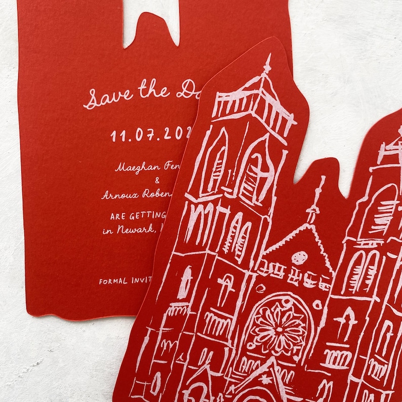 May include: Red wedding invitation with a church illustration and the text "Save the Date" and event details. The invitation is die-cut with a unique shape. The text includes the date, names, and location.