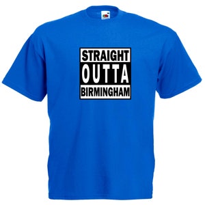 May include: Royal blue t-shirt featuring the text "STRAIGHT OUTTA BIRMINGHAM" in a black and white rectangular design. The shirt has a crew neck.