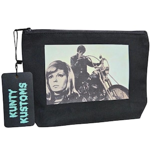 May include: Black zippered pouch with a retro image of a woman and a man on a motorcycle. The pouch has a tag that reads "KUNTY KUSTOMS" in teal lettering. The image on the pouch is in black and white.