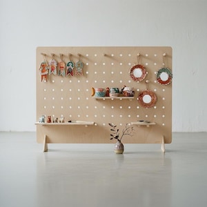 Tabletop Pegboard Display Stand, Wood Counter Organizer for Craft Fairs, Markets, Retail Booths shown in an AI-generated listing photo