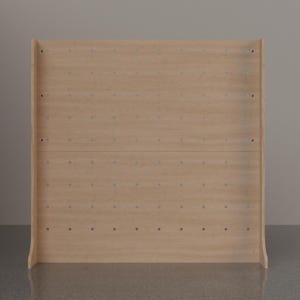 May include: A light-colored wooden pegboard display stand featuring a grid of evenly spaced circular holes across its flat surface. The structure includes two side panels that extend forward, providing stability for the upright rectangular board.