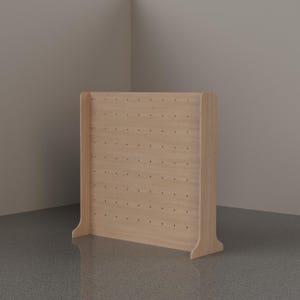 May include: A light-colored wooden pegboard display stand featuring a rectangular panel with a grid of evenly spaced circular holes. The structure includes two side supports that extend outward at the base to provide stability for the unit.