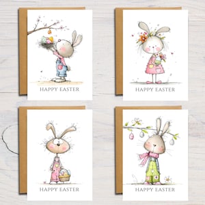 May include: Four Easter greeting cards with illustrations of bunnies. Each card features a different bunny design, holding eggs, flowers, or a basket. The text "HAPPY EASTER" is printed on each card.