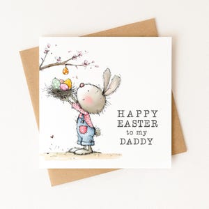 May include: Easter greeting card featuring a cartoon bunny holding a nest with colorful eggs. The bunny wears blue overalls and a pink shirt. The card reads "Happy Easter to my Daddy" on a white background, with a brown envelope.