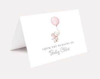 May include: A white elephant holding a pink balloon with the text "From the nursery of Baby Chloe" on a white card.