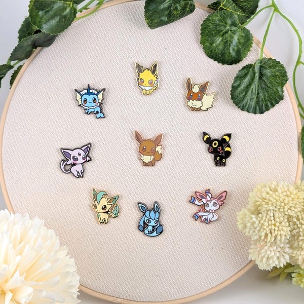 Spille in smalto rigido Eeveelutions con espositore in acrilico opzionale