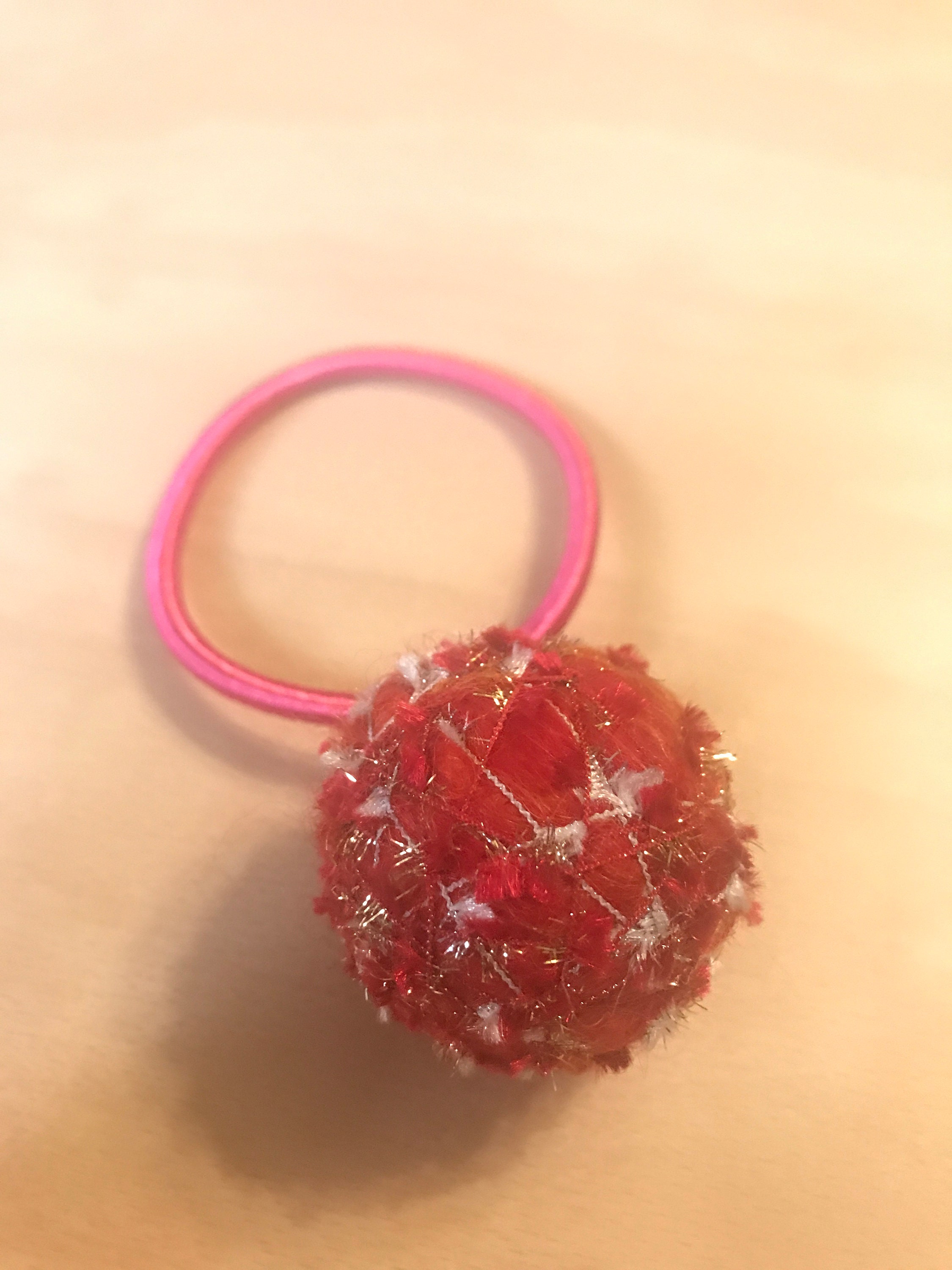 A cute and unique yarn ball hair tie Etsy