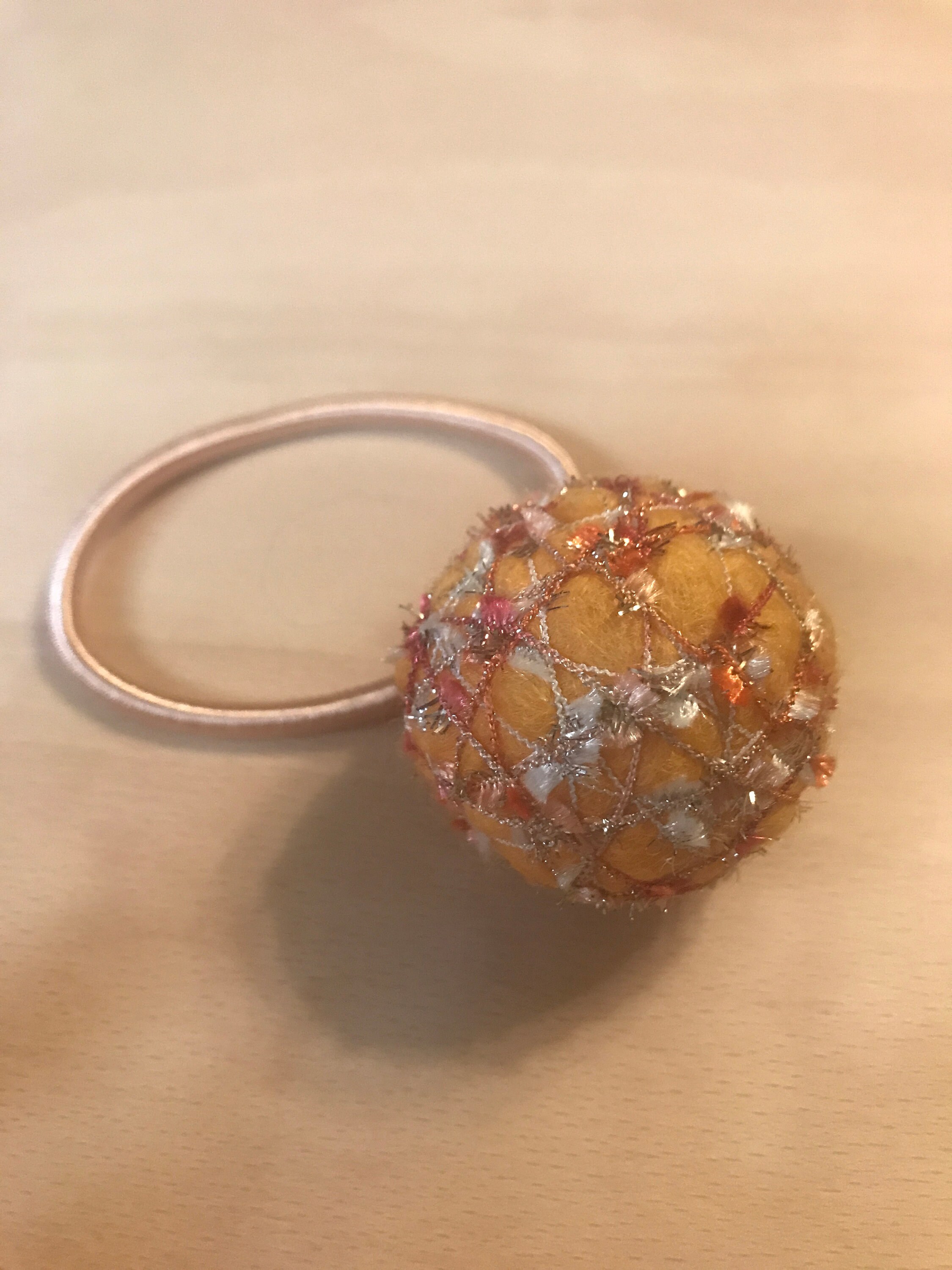 A cute and unique yarn ball hair tie Etsy